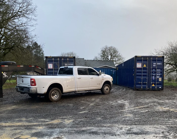 multiple storage containers placed in commercial yard