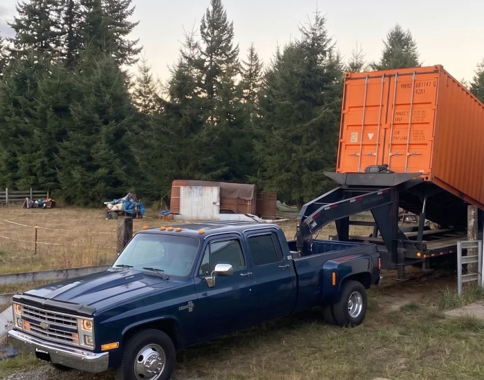 orange shipping container offloading